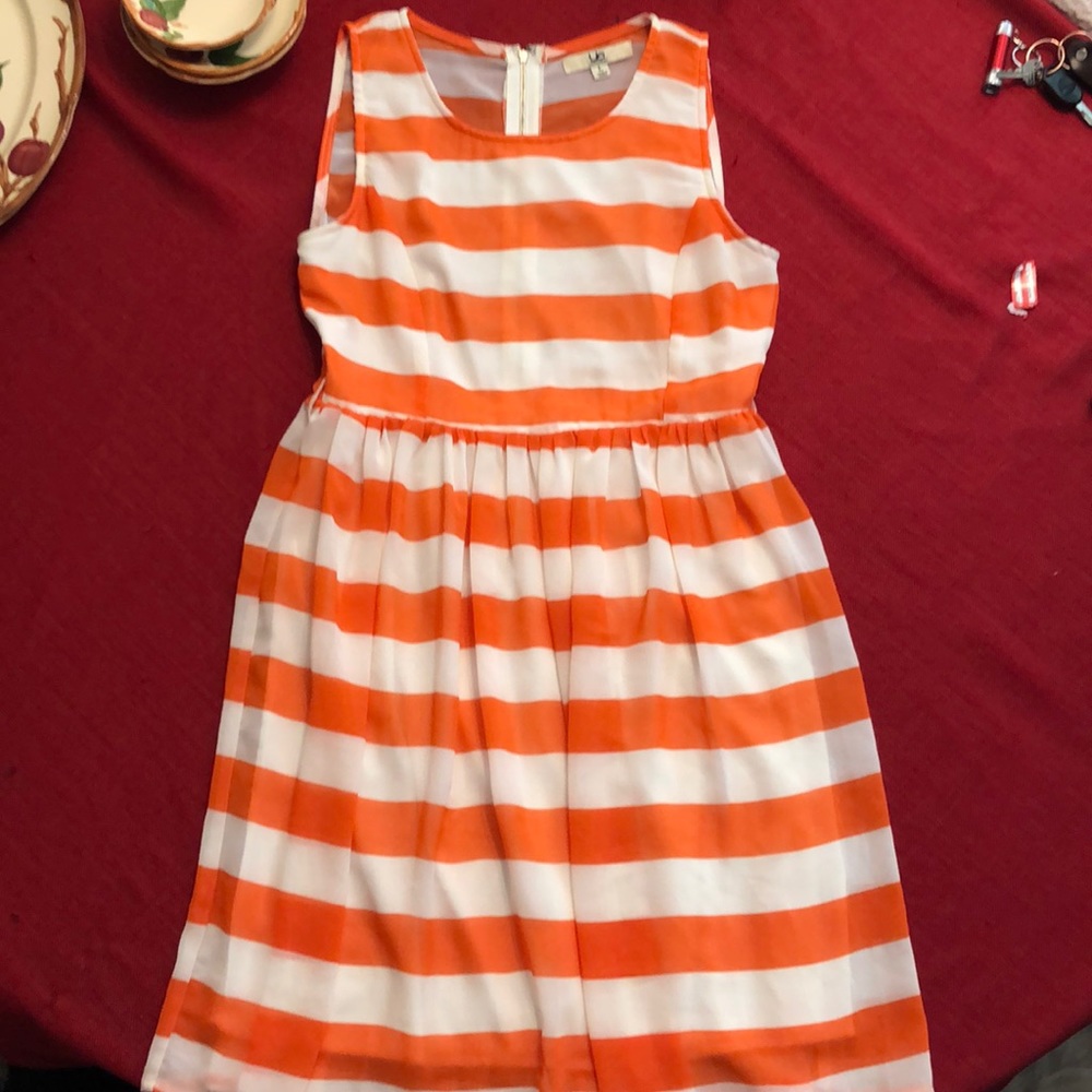 Orange and white striped dress.